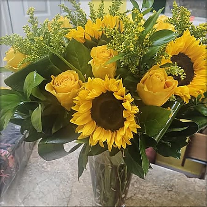 Graduation arrangement by Serenity Flowers