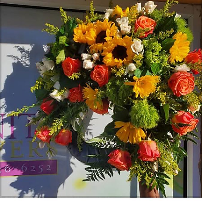 Sympathy arrangement by Serenity Flowers